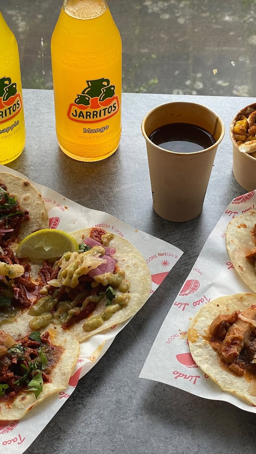 Tacos al pastor with guacamole and lime